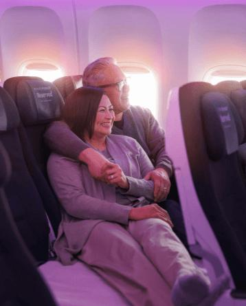 Couple relaxing on plane