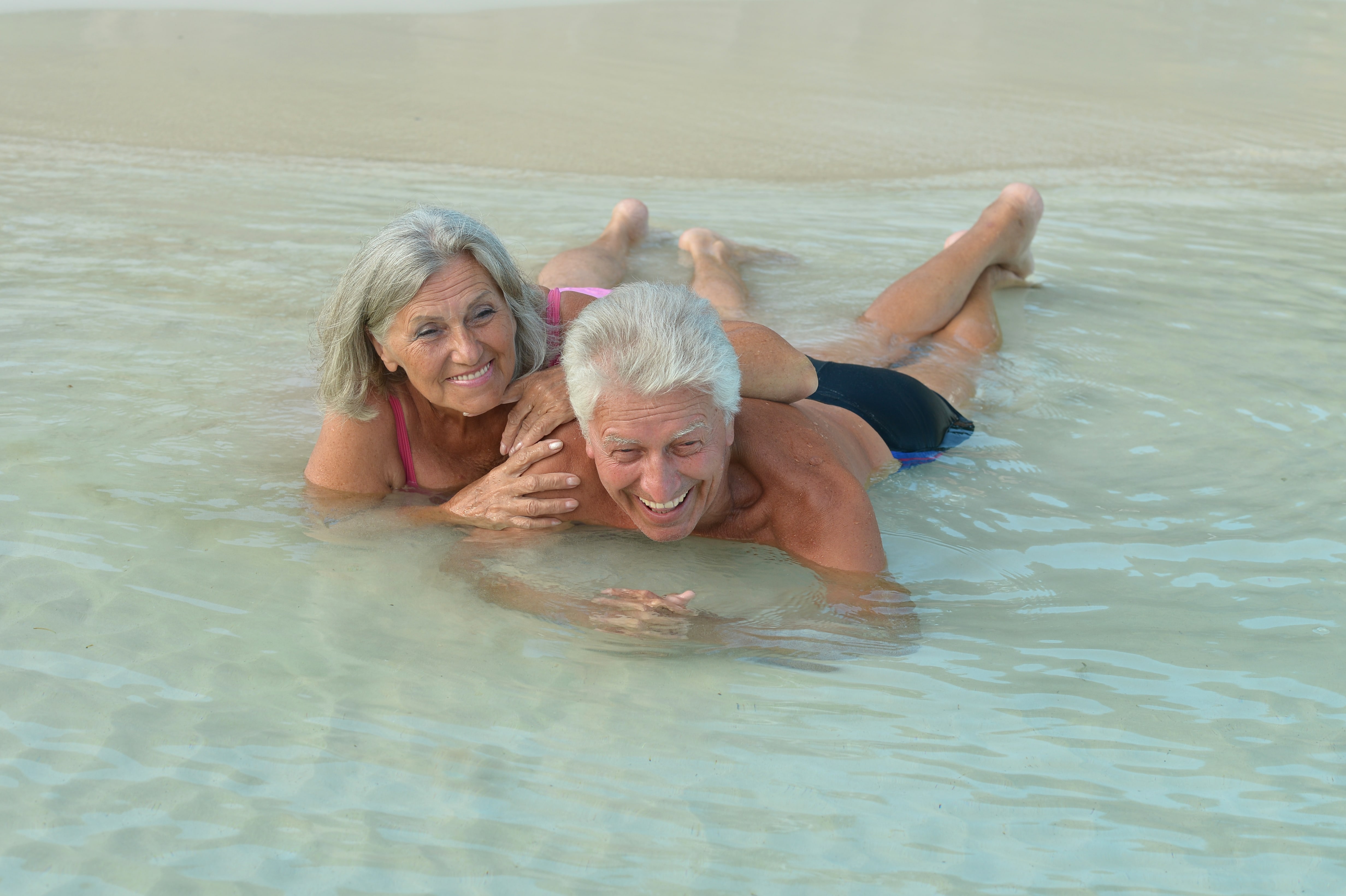 Baby boomers in the sea on a beach