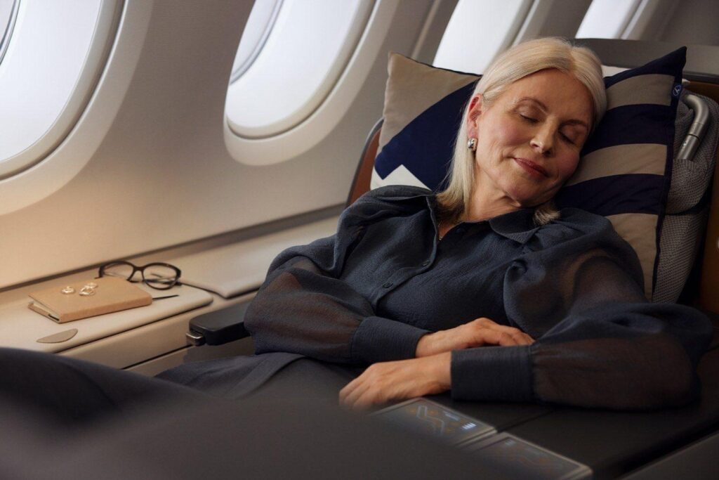 Lady asleep in Lufthansa business class